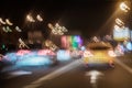 Yellow taxi, urban street night traffic, lights of cars at dusk on the road of city. Transportation concept. Abstract Royalty Free Stock Photo