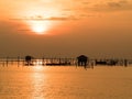 Blurred beautiful sunset above the sea in thailand. Silhouette of fish farms at sunset Royalty Free Stock Photo