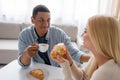 blurred blonde woman holding delicious croissant Royalty Free Stock Photo