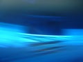 Blurred blue background with interlacing, refraction, and rotation effects