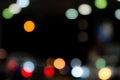 Blurred blue, orange, green, red, and white bokeh  abstract background. Blur bokeh on dark background. City light in the night. Royalty Free Stock Photo