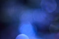 Blurred, bokeh blue lights background. Abstract sparkles