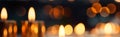 Blurred bokeh, bright candle lights, lighting on a dark background - AI generated image
