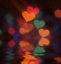 Blurred bokeh colorful lights with reflection in water