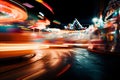 Blurred bokeh effect at vibrant carnival colorful rides, games, food stalls illuminated at night Royalty Free Stock Photo