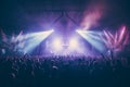 Blurred bokeh effect of a vibrant concert stage with colorful lights and a crowd in the background Royalty Free Stock Photo