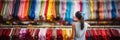 Blurred bokeh effect woman browsing clothing rack, blurred bokeh background of department store