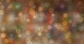 Blurred bokeh light on dark colorful background. New Year holidays template. Abstract glitter defocused blinking stars Glowing and Royalty Free Stock Photo