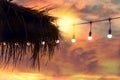 Blurred light on sunset with yellow string lights decor in beach restaurant Royalty Free Stock Photo