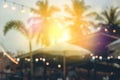 Blurred light on sunset with yellow string lights decor in beach restaurant Royalty Free Stock Photo