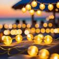 Blurred bokeh light on sunset with yellow string lights decor in beach restaurant Royalty Free Stock Photo