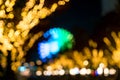 Blurred bokeh night harbor lights background with ferris wheel