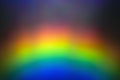 Blurred bright rainbow light refraction overlay effect for mockups. Organic diagonal holographic flare on a light wall Shadows for Royalty Free Stock Photo