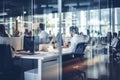 Blurred business employees working in modern office, glass partitions