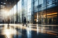 Blurred business people rush at trade fair hall or hi-tech airport with sunlight. Abstract business background Royalty Free Stock Photo