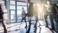 Blurred business people at a trade fair floor Royalty Free Stock Photo