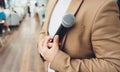 blurred of businessman hand holding microphone for speech presentation in conference hall, Seminar and Speaker Concept Royalty Free Stock Photo