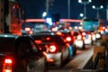 Blurred car traffic light at night city. Traffic jam in evening rush hour. Royalty Free Stock Photo