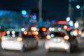 Blurred car traffic light at night city. Traffic jam in evening rush hour. Royalty Free Stock Photo