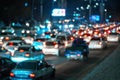 Blurred car traffic light at night city. Traffic jam in evening rush hour. Royalty Free Stock Photo