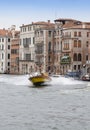 Blurred carabinieri police boat speeds along the Grand Canal of Venice, Italy Royalty Free Stock Photo
