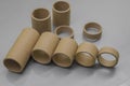 Blurred cardboard spools for winding. Reels made of cardboard. Background of cardboard bobbins. Selective focus