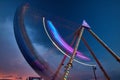 Blurred carnival ride swinging during dusk Royalty Free Stock Photo