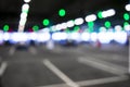 Blurred cars in car parking lot in shopping mall. Bokeh lights background. Abstract blur car parking lot for background. Blurred c Royalty Free Stock Photo