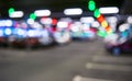 Blurred cars in car parking lot in shopping mall. Bokeh lights background. Abstract blur car parking lot for background. Blurred c Royalty Free Stock Photo