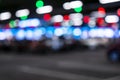 Blurred cars in car parking lot in shopping mall. Bokeh lights background. Abstract blur car parking lot for background. Blurred c Royalty Free Stock Photo