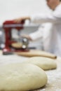 Blurred Chef Using Dough Mixer In Kitchen