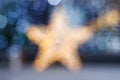 Blurred Christmas background. Gold star and blue blurry lighting Royalty Free Stock Photo