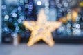 Blurred Christmas background. Gold star and blue blurry lighting Royalty Free Stock Photo