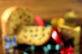 Blurred christmas background. Wooden table with panetone decoration and gift boxes