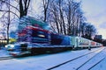 Blurred Christmas illuminated train. Train arrived at the station. Holiday decorations of train