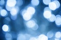 Blurred christmas lights classic blue background. Abstract bokeh with soft light. Shiny festive texture Royalty Free Stock Photo