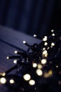 Christmas fairy lights wrapped around card at night Royalty Free Stock Photo