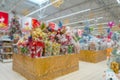 Blurred Christmas supermarket. Sale of festive Christmas accessories and trees in a retail store Royalty Free Stock Photo