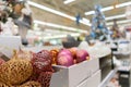 Sale of festive Christmas accessories and trees in a retail store. Blurred background in the store Royalty Free Stock Photo