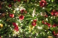 Blurred Christmas tree with golden garland and red balls. Abstract pattern. Xmas Royalty Free Stock Photo