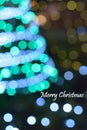 Blurred christmas tree lights with merry christmas text Royalty Free Stock Photo