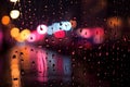 Blurred city lights seen through a window with colorful raindrops Royalty Free Stock Photo