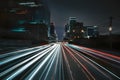 Blurred city lights and vehicles depict urban hustle and bustle