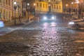 Blurred city,paving stones against the background of the night city,moss overgrown old paving stones laid out on the road,national