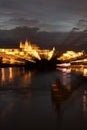 Blurred Cityscape of Prague with River Vltava at Night Royalty Free Stock Photo