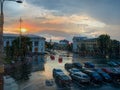 Blurred cityscape through the window pane during rain at sunset Royalty Free Stock Photo