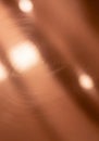 Blurred close-up of a brushed copper surface with a warm bronze hue. The texture Royalty Free Stock Photo