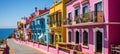 Blurred coastal promenade with cafes, umbrellas, and bicycles for outdoor dining and leisure