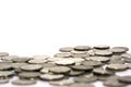 Blurred coins on a white background.