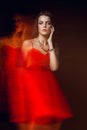 Blurred color art portrait of a girl on a dark background. Fashion woman with beautiful makeup and a light summer dress. Sensual Royalty Free Stock Photo